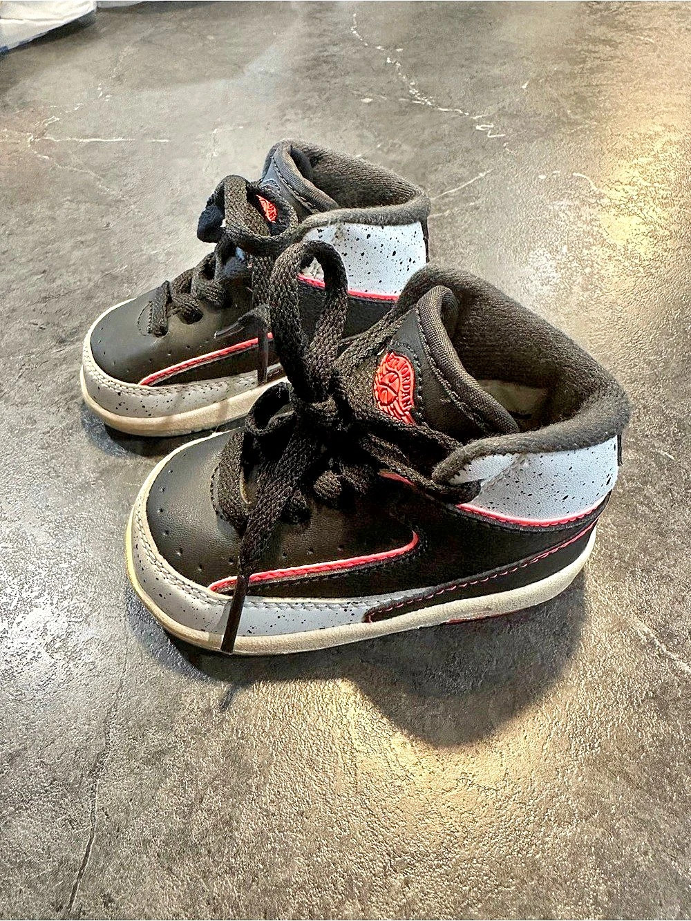 Baby Air Jordan 2 retro ‘infrared 23’ sneakers in the size 3C.